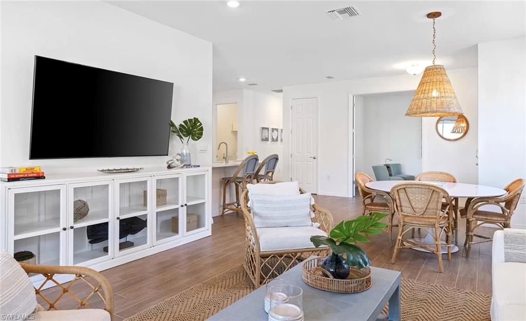 1213 Enbrook Loop Naples, FL 34114 - Photo 5 of 24 a living room with furniture and a flat screen tv