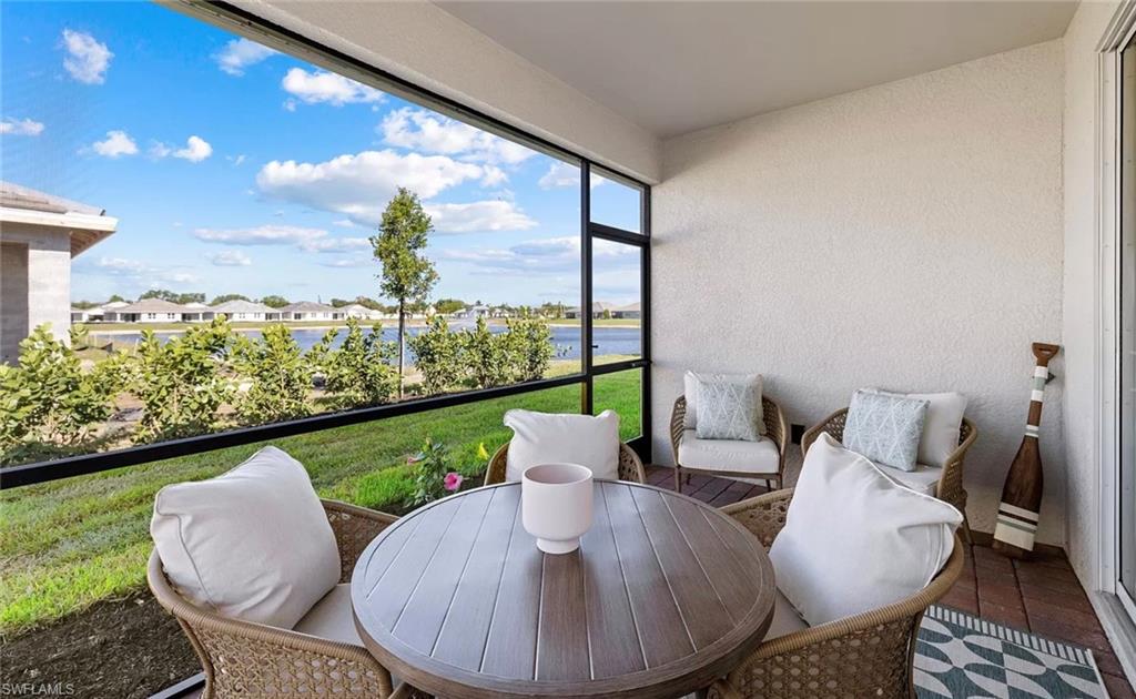 1213 Enbrook Loop Naples, FL 34114 - Photo 10 of 24 a view of a chairs and table in the balcony