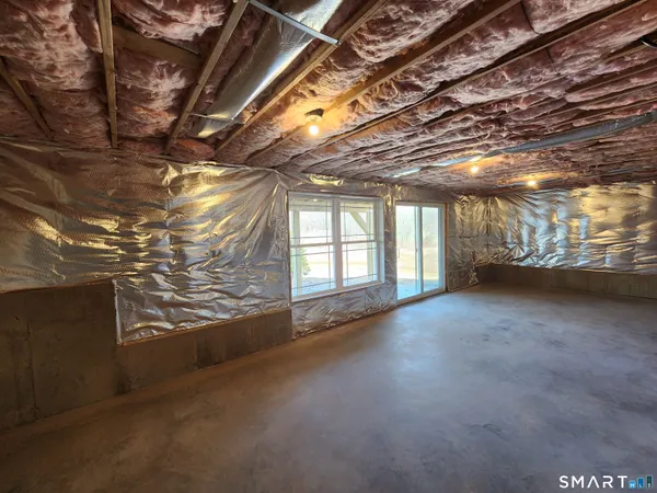 a view of a room with wooden walls