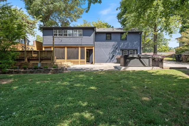 a view of a house with a yard porch and sitting area