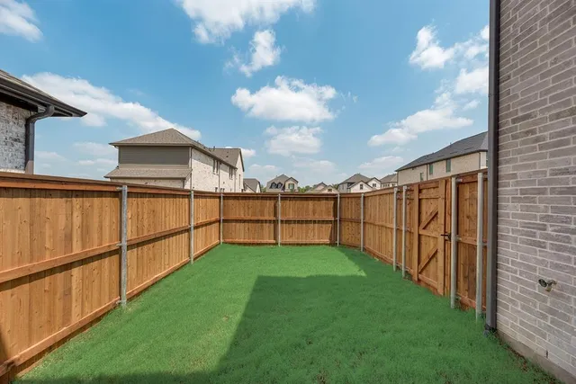 a view of a backyard with hardwood