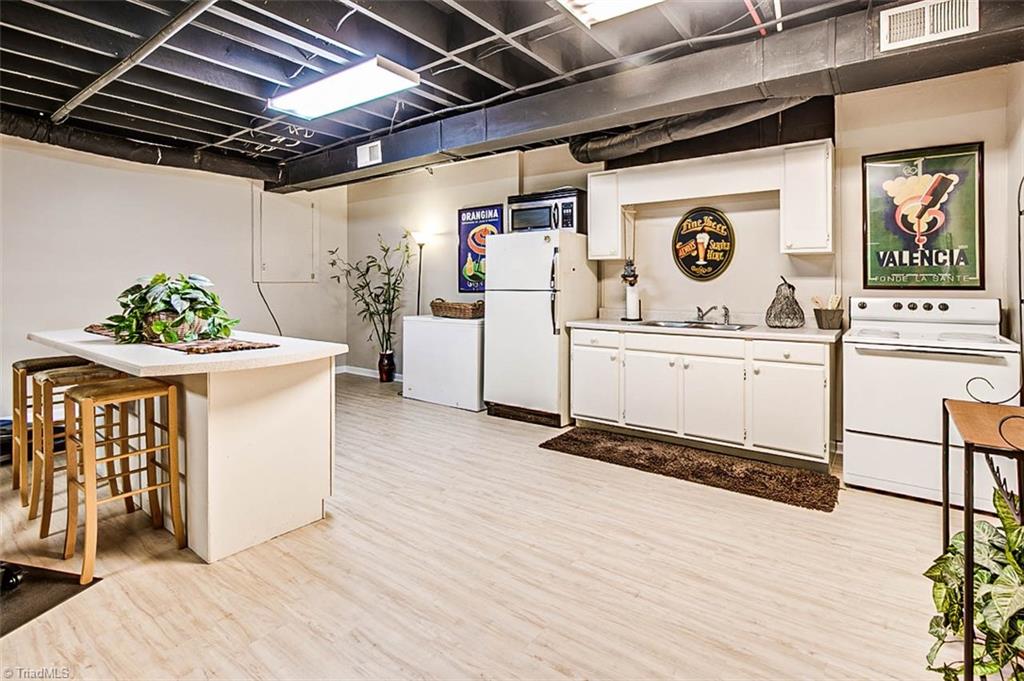 614 Inwood Road Asheboro, NC 27205 - Photo 23 of 33 Basement rec room, kitchen, all appliances remain