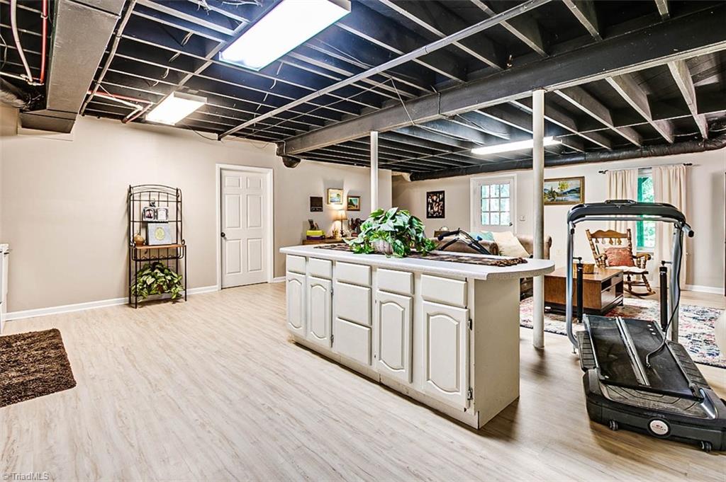 614 Inwood Road Asheboro, NC 27205 - Photo 24 of 33 Basement rec room, kitchen area eat-at island