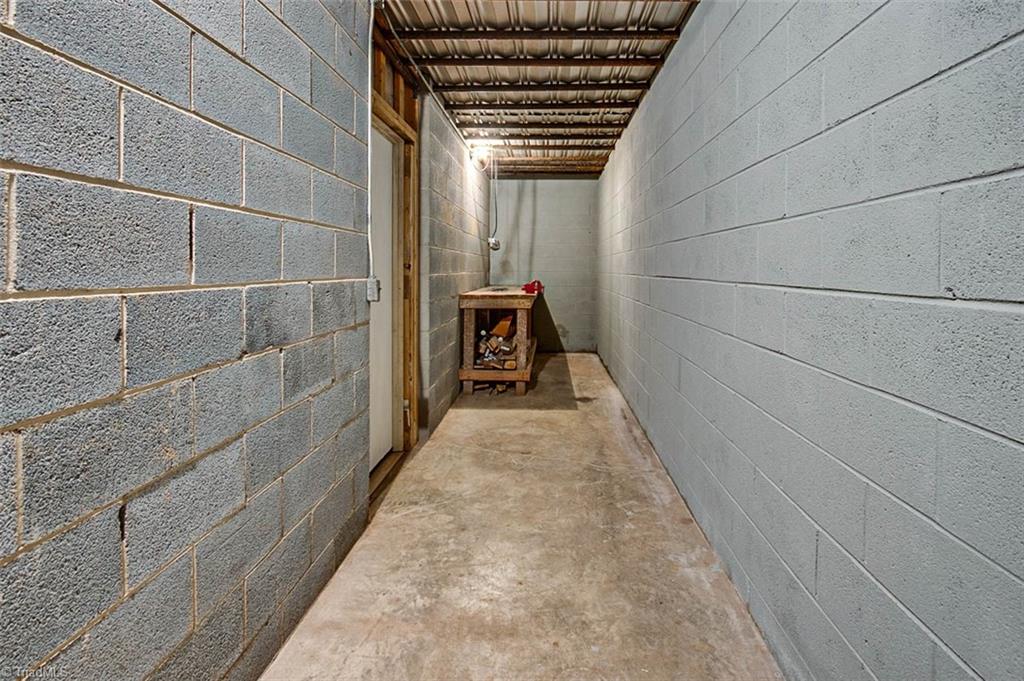 614 Inwood Road Asheboro, NC 27205 - Photo 28 of 33 Unfinished basement, work bench
