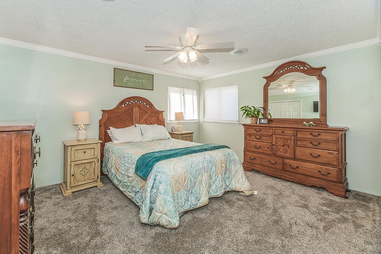 2820 Riverview Drive Madera, CA 93637 - Photo 21 of 60 a bedroom with a bed and a dresser