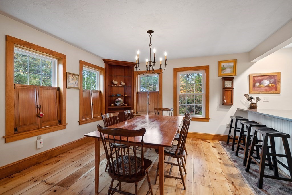 68 Frost Road Tyngsborough, MA 01879 - Photo 8 of 37 a view of a dining room with furniture window and wooden floor