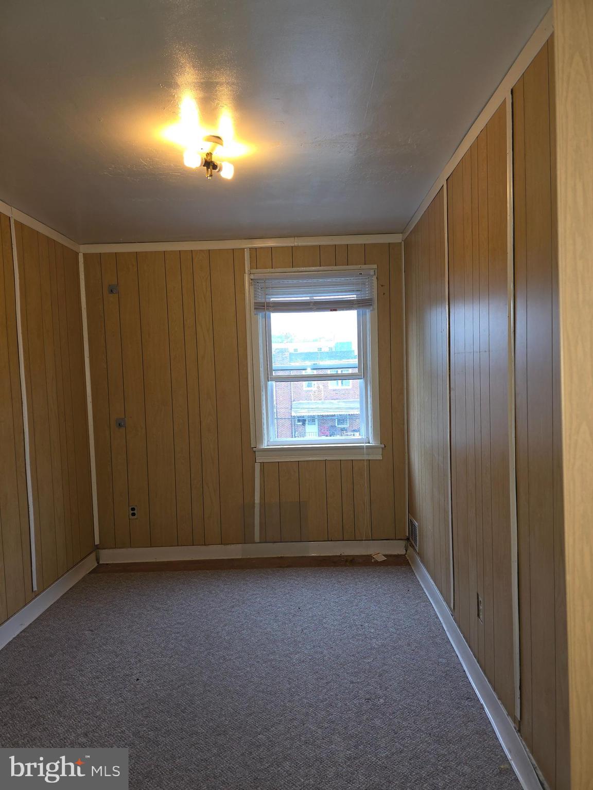 1212 Kevin Road Baltimore, MD 21229 - Photo 8 of 9 a view of an empty room with a window
