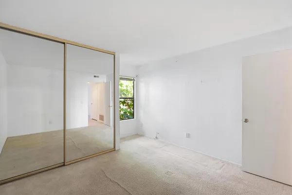a view of an empty room and window