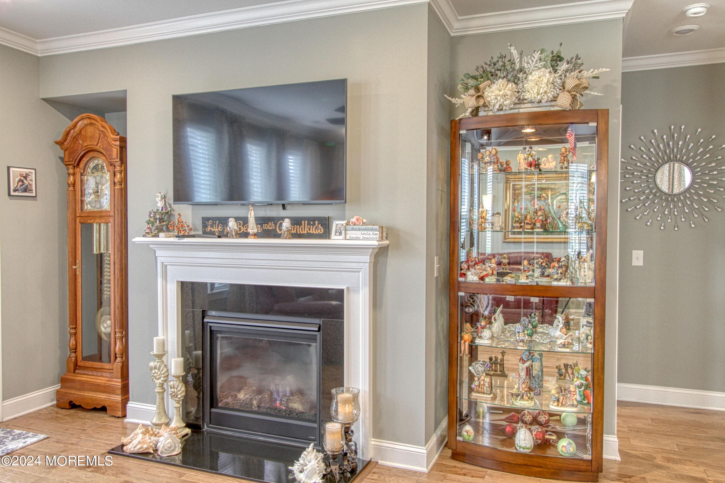 39 Butler Drive Barnegat, NJ 08005 - Photo 14 of 62 a living room with a fireplace windows and a fireplace