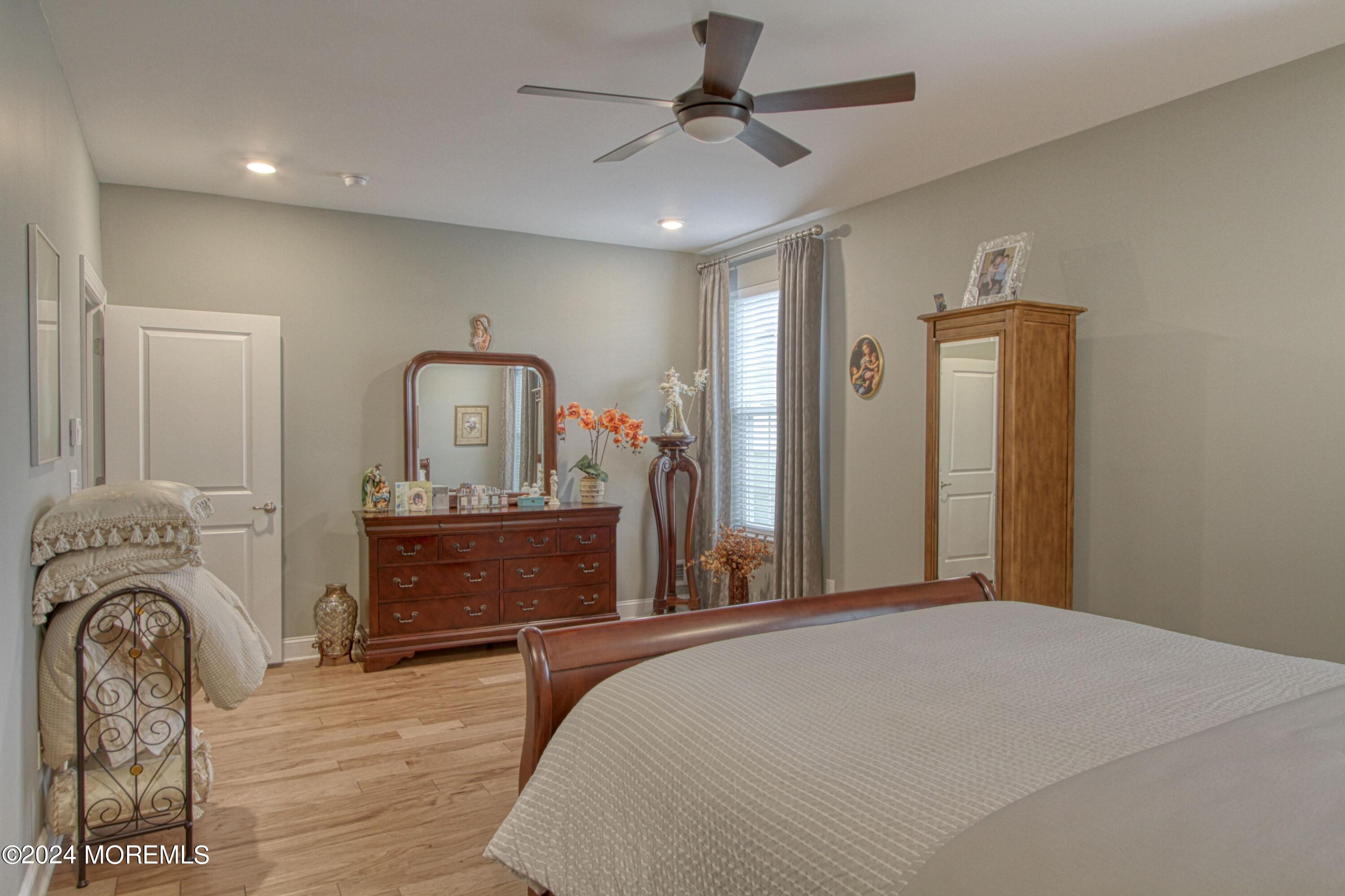 39 Butler Drive Barnegat, NJ 08005 - Photo 19 of 62 a bedroom with a bed and a dresser