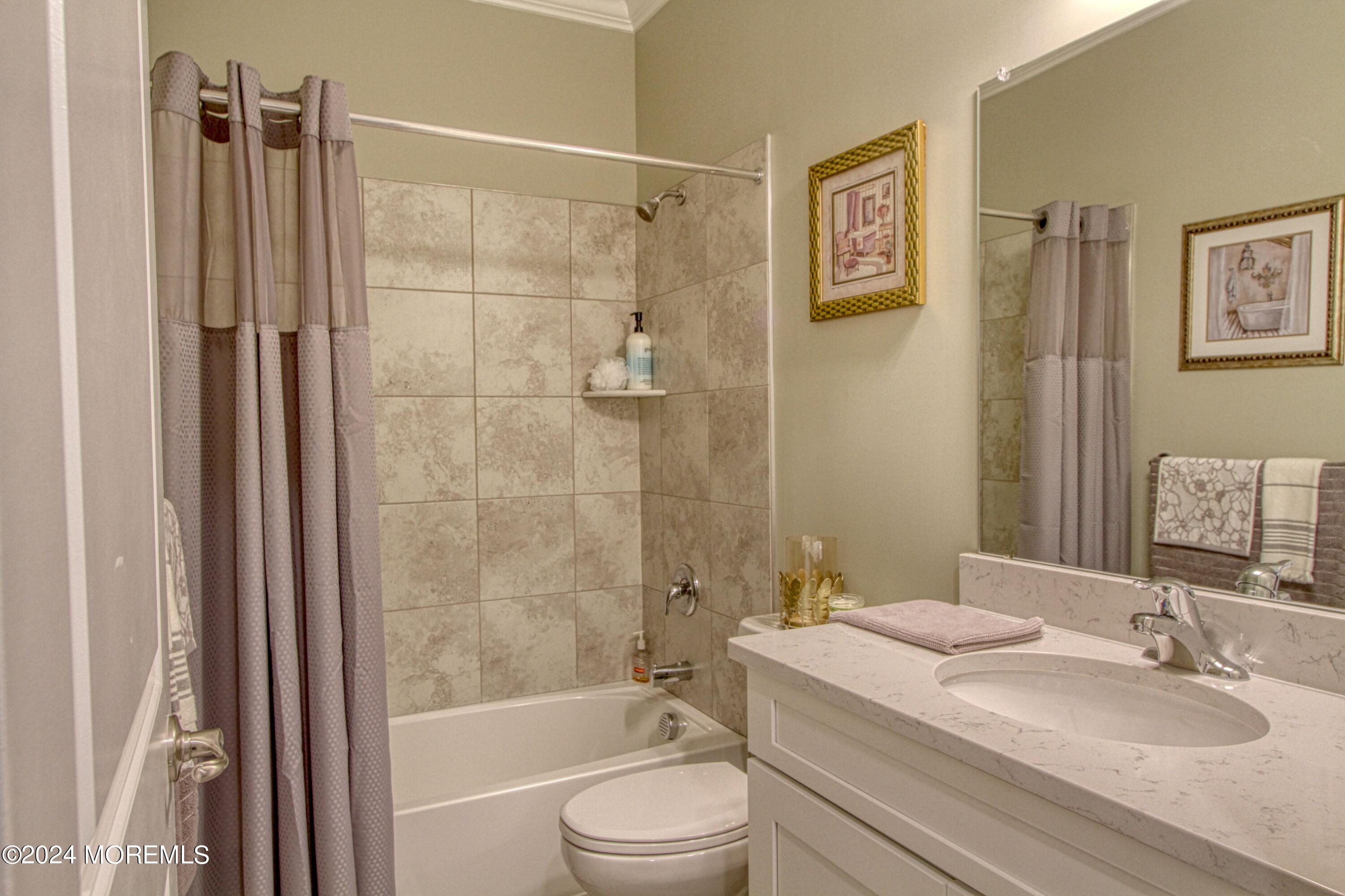 39 Butler Drive Barnegat, NJ 08005 - Photo 20 of 62 a bathroom with a granite countertop sink toilet and shower