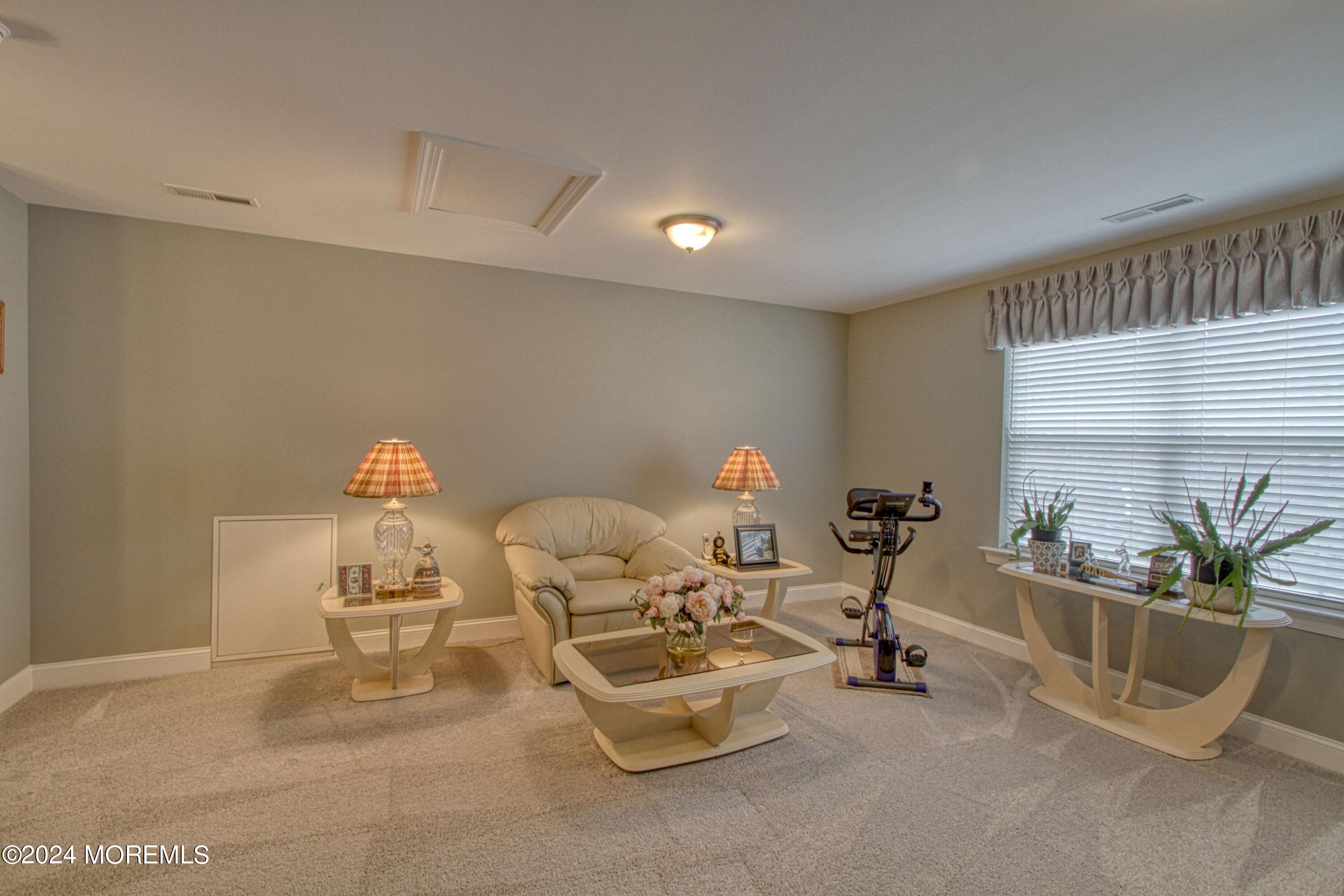 39 Butler Drive Barnegat, NJ 08005 - Photo 24 of 62 a living room with furniture and a potted plant
