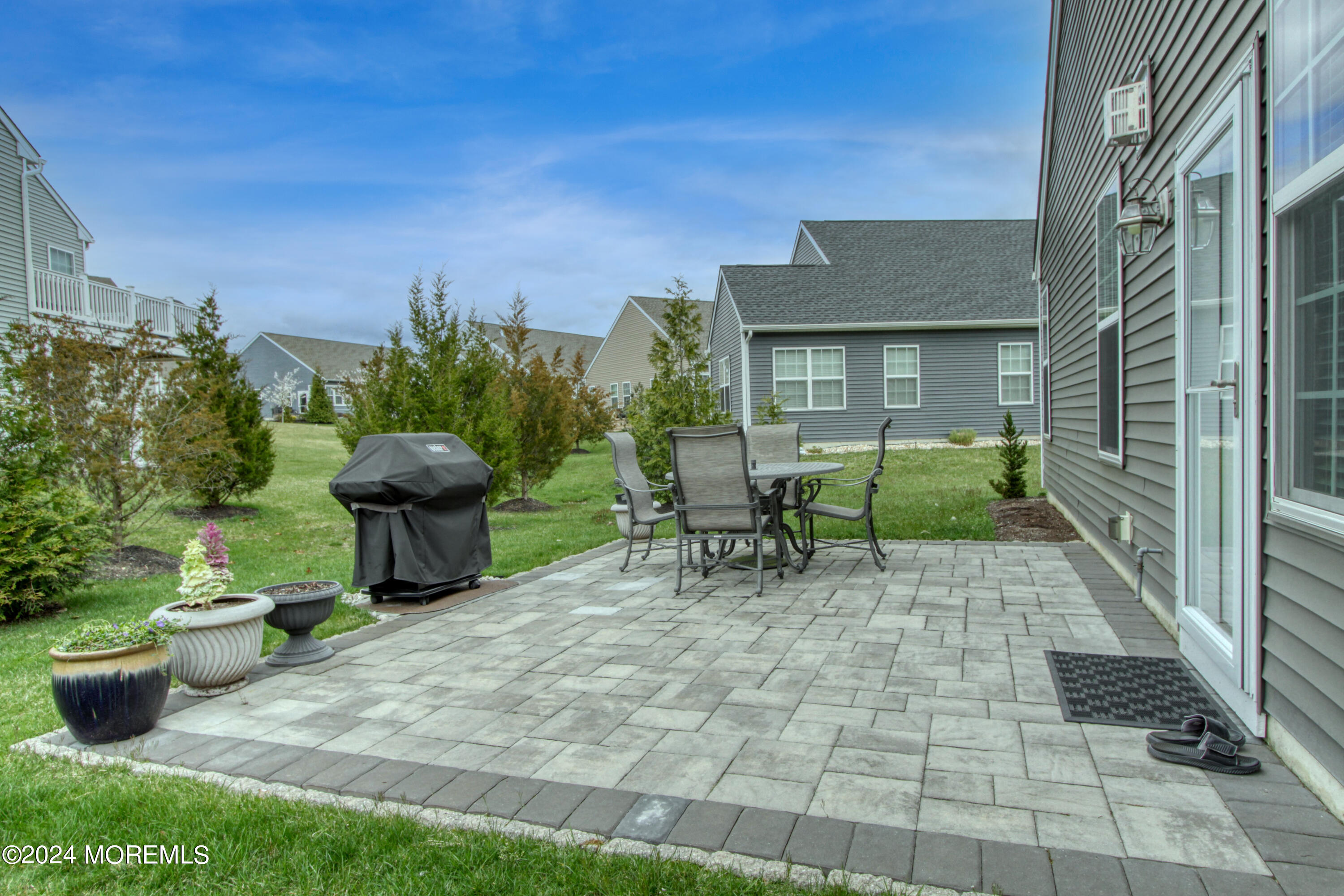 39 Butler Drive Barnegat, NJ 08005 - Photo 28 of 62 a view of a chairs and table in backyard of the house