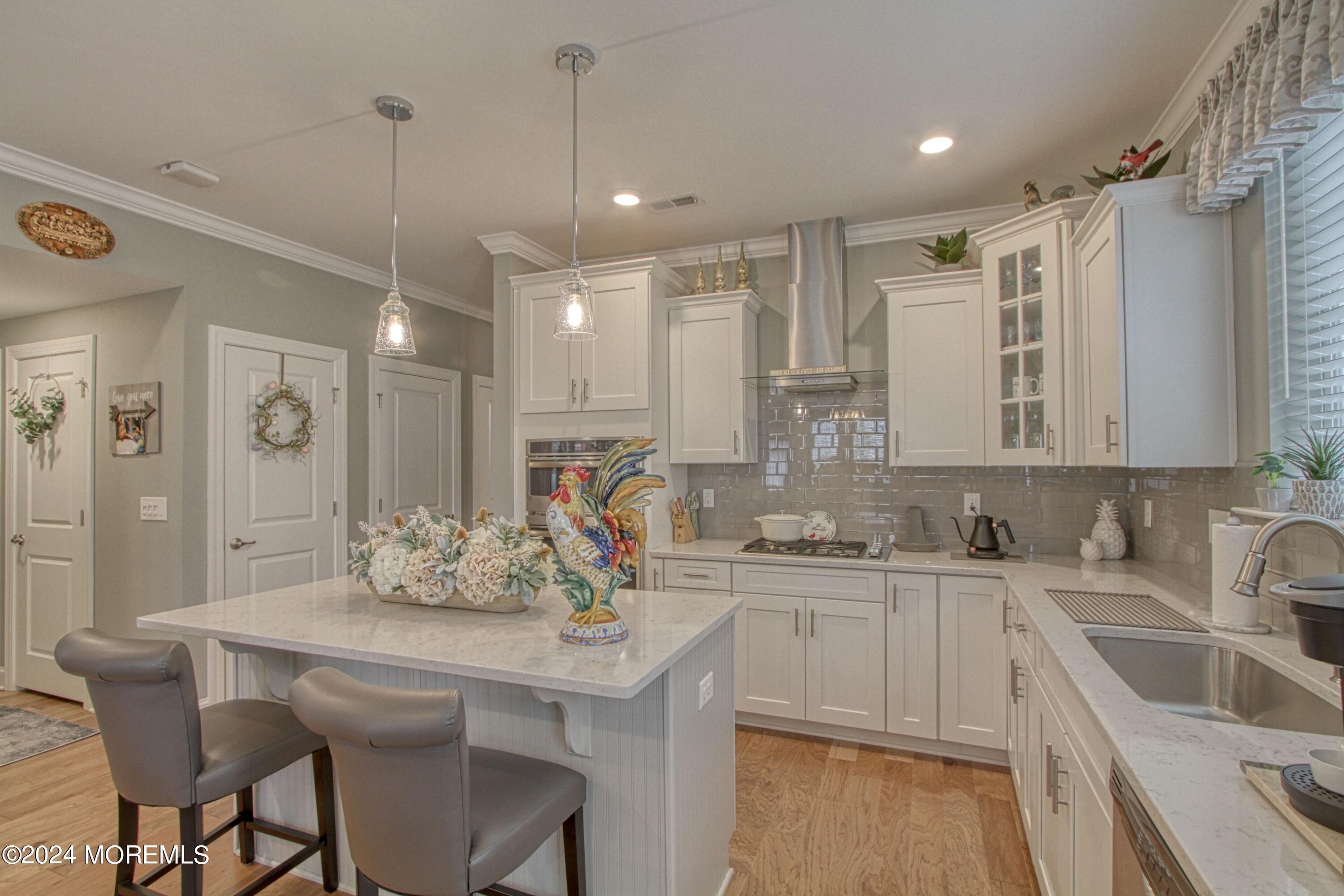 39 Butler Drive Barnegat, NJ 08005 - Photo 3 of 62 a kitchen with stainless steel appliances kitchen island granite countertop a sink and cabinets
