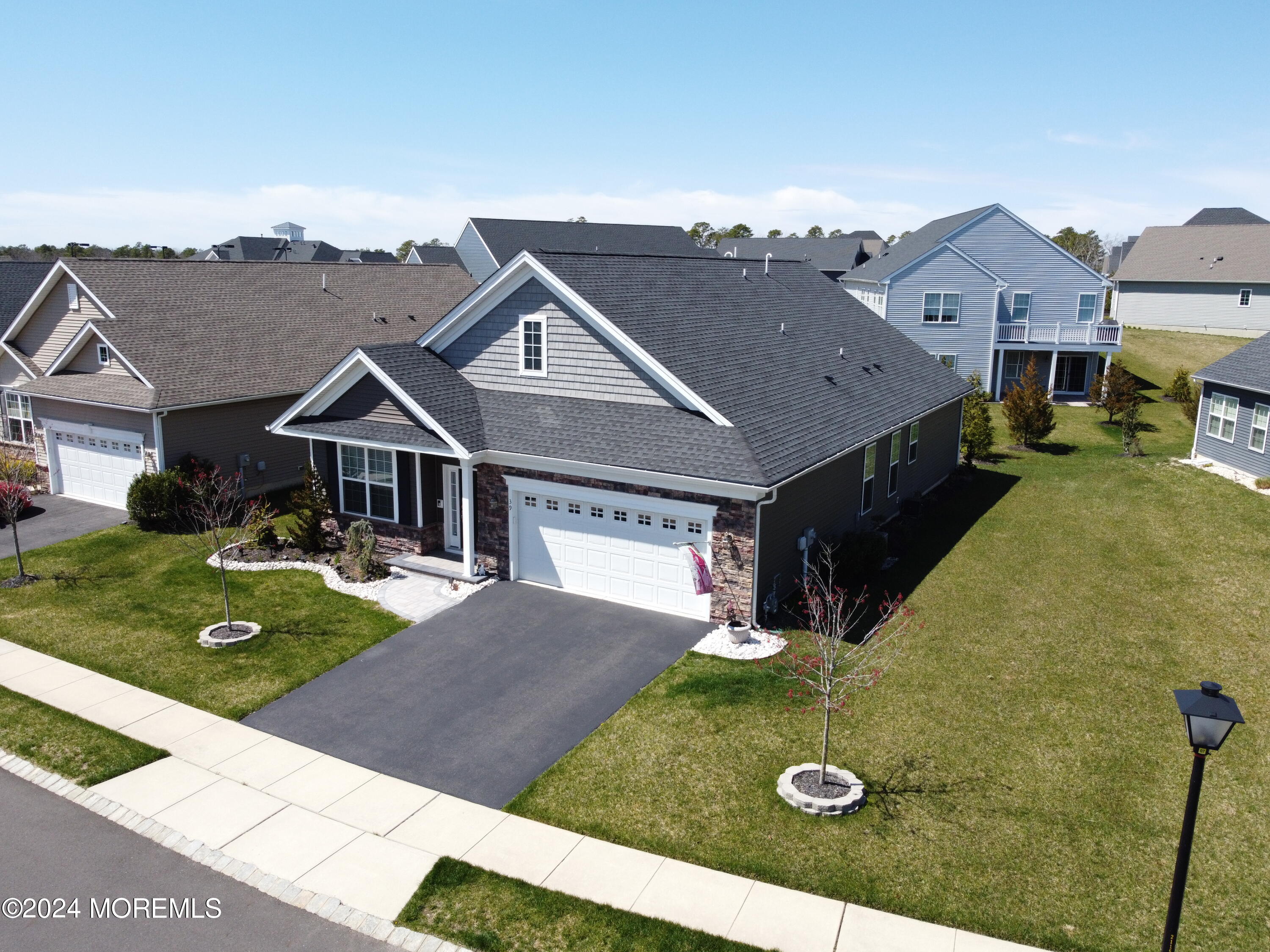 39 Butler Drive Barnegat, NJ 08005 - Photo 34 of 62 a aerial view of a house with table and chairs