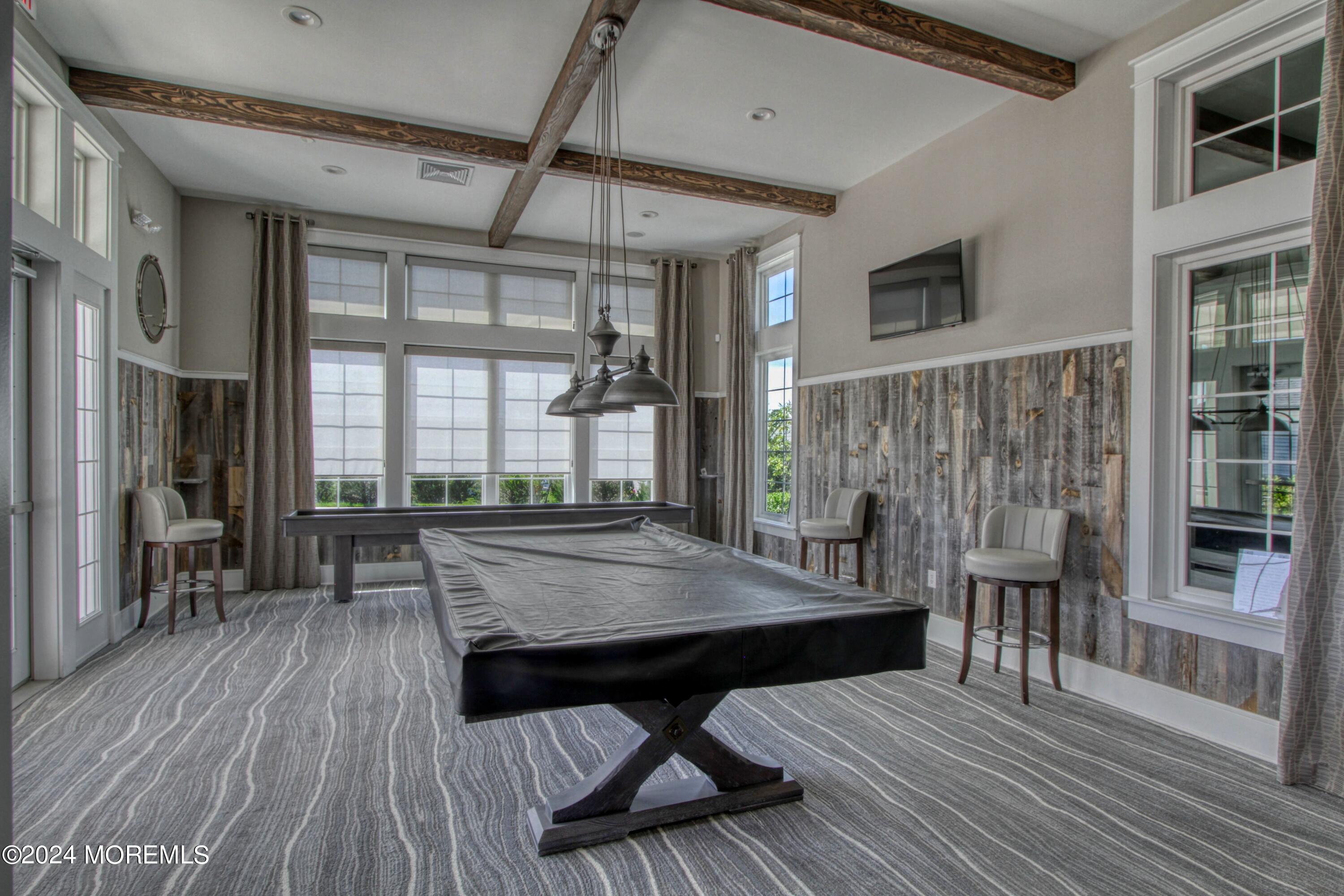 39 Butler Drive Barnegat, NJ 08005 - Photo 52 of 62 a view of a patio with table and chairs with wooden floor and floor to ceiling window