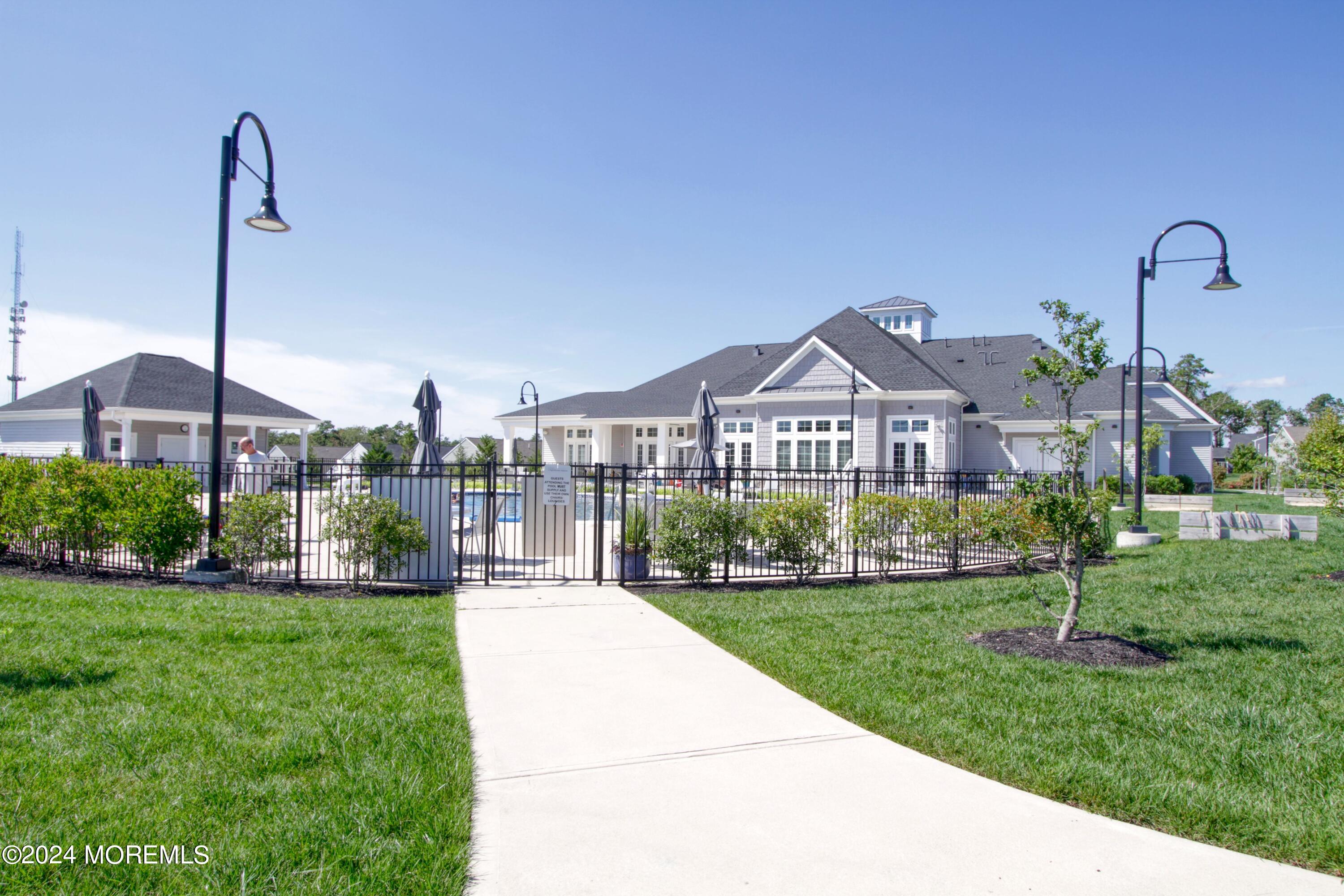 39 Butler Drive Barnegat, NJ 08005 - Photo 55 of 62 a front view of a house with garden