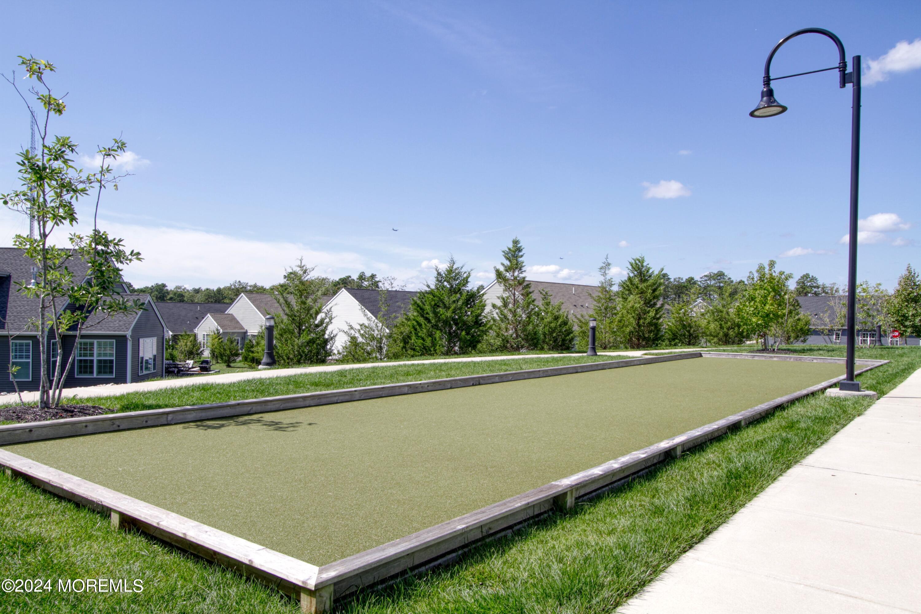 39 Butler Drive Barnegat, NJ 08005 - Photo 60 of 62 a view of a swimming pool with a yard and plants