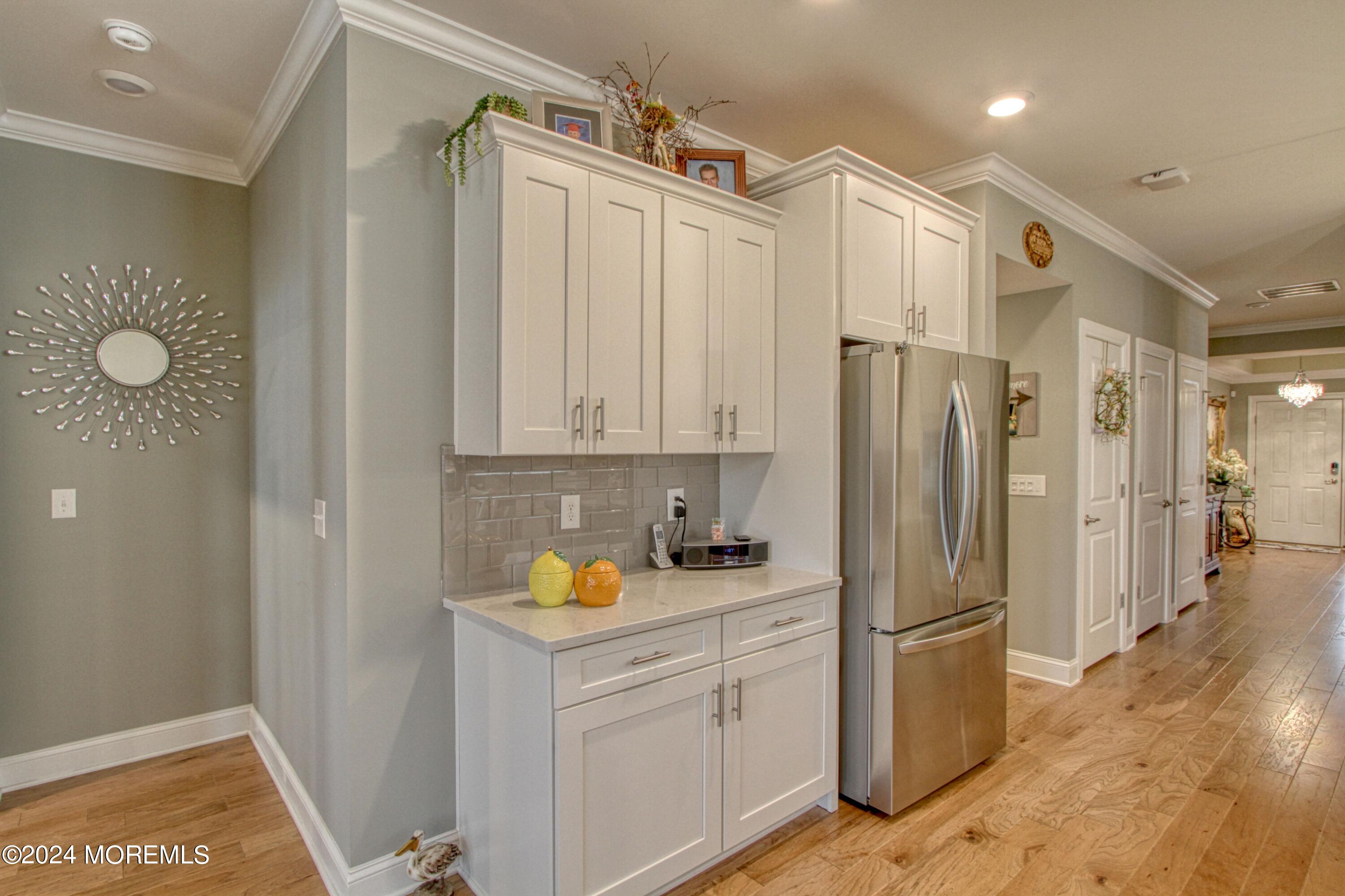 39 Butler Drive Barnegat, NJ 08005 - Photo 7 of 62 a kitchen that has a refrigerator a sink and cabinets