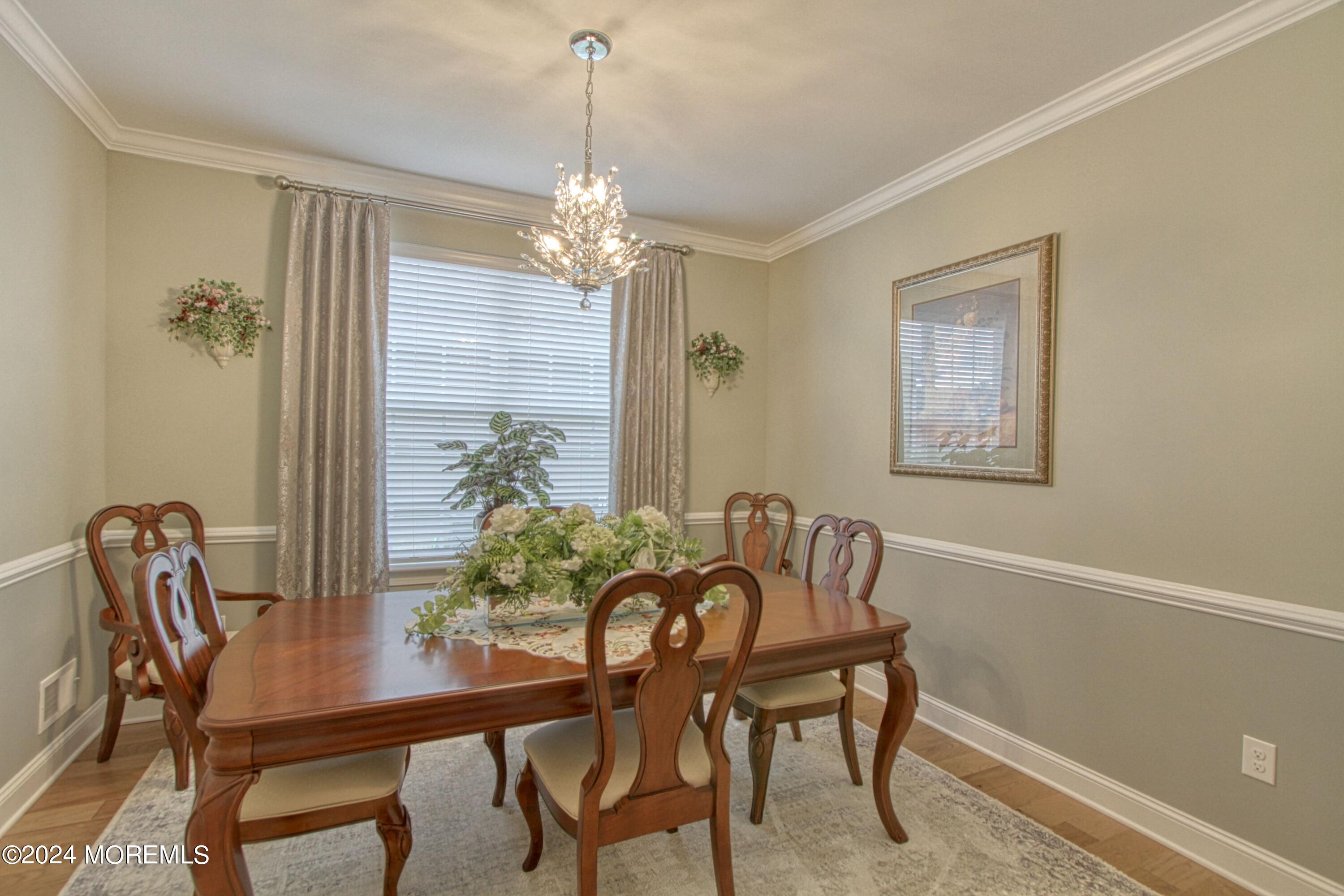 39 Butler Drive Barnegat, NJ 08005 - Photo 8 of 62 a view of a dining room with furniture and chandelier