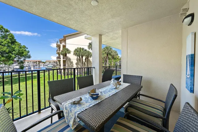 a view of a balcony dining area with furniture