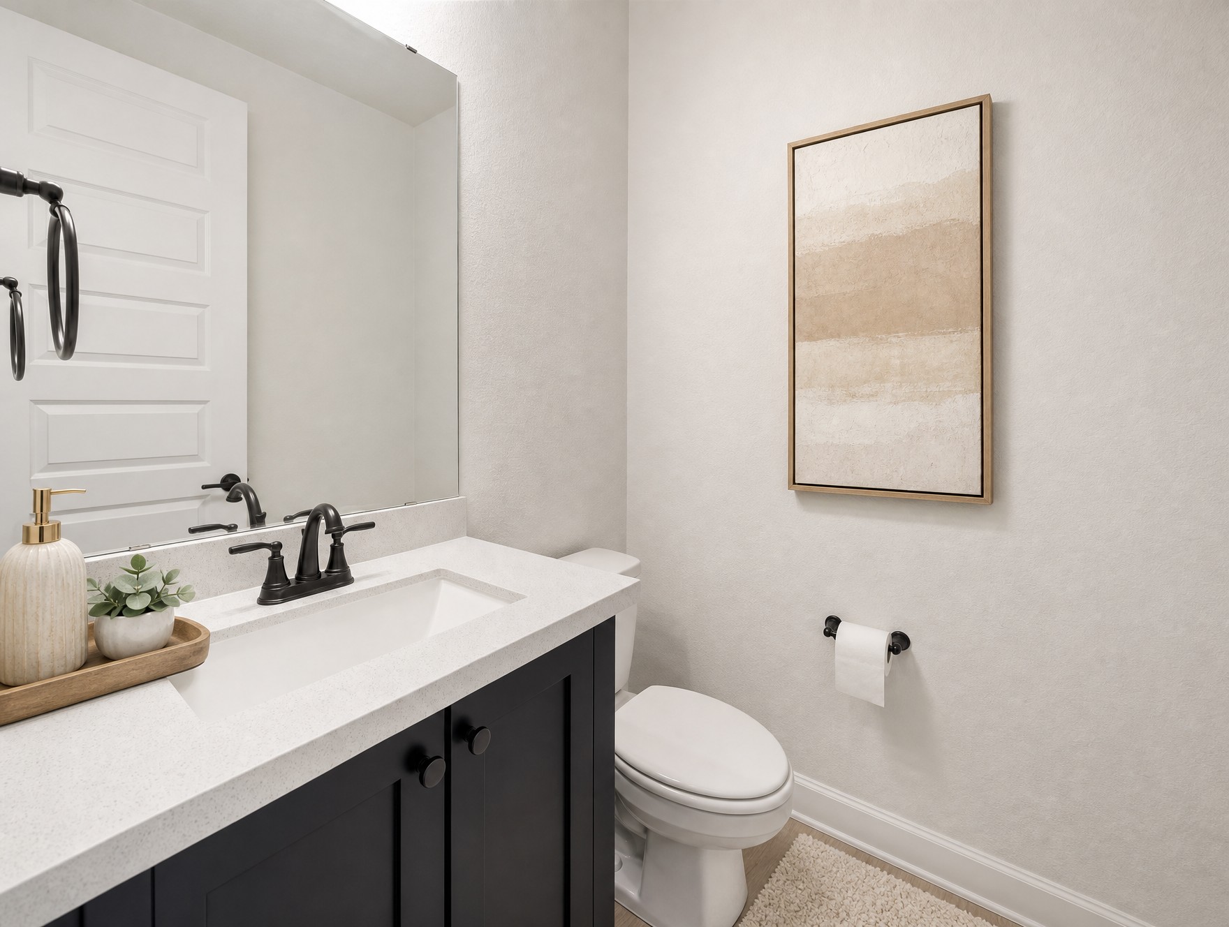 1440 Riva Ridge Drive Leander, TX 78641 - Photo 20 of 37 A well-appointed guest bath featuring a dark vanity, light countertops, and clean fixtures.