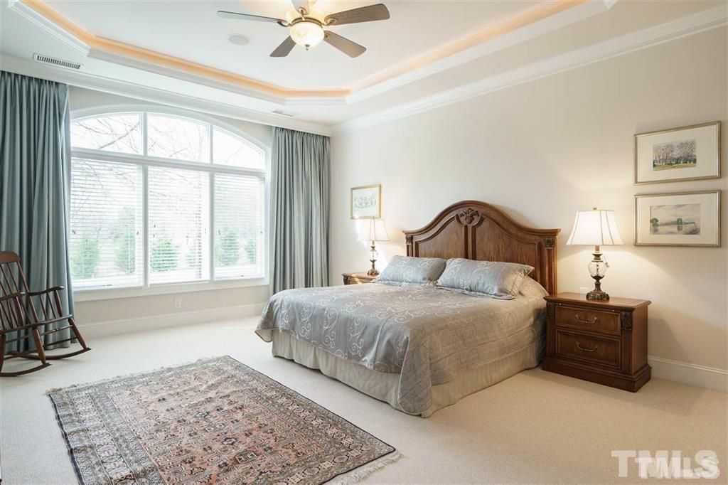 4008 Ovid Lane Raleigh, NC 27613 - Photo 15 of 25 a bedroom with a large bed and a window