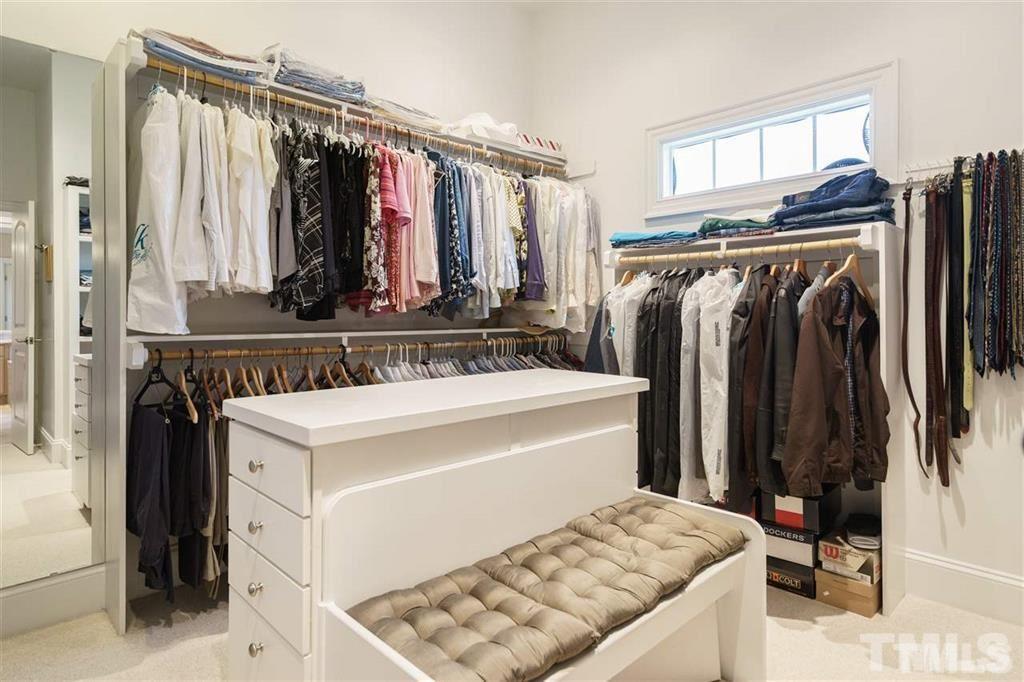 4008 Ovid Lane Raleigh, NC 27613 - Photo 18 of 25 a view of walk in closet with clothes and shoes
