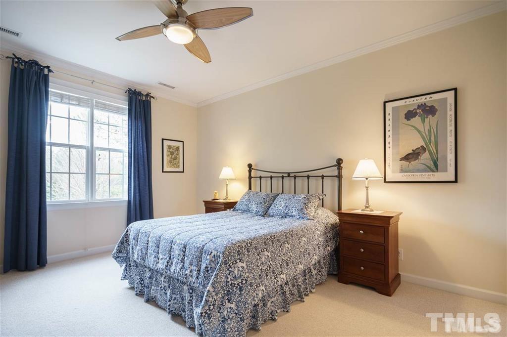 4008 Ovid Lane Raleigh, NC 27613 - Photo 21 of 25 a bedroom with a bed and a window