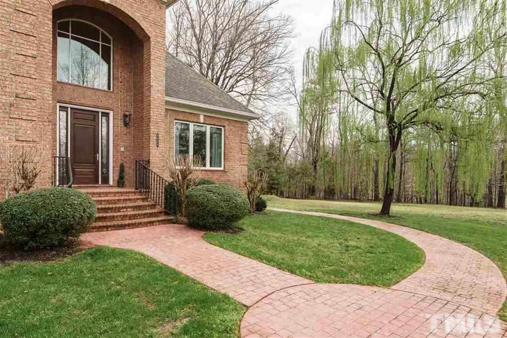 4008 Ovid Lane Raleigh, NC 27613 - Photo 24 of 25 a view of a house with a yard