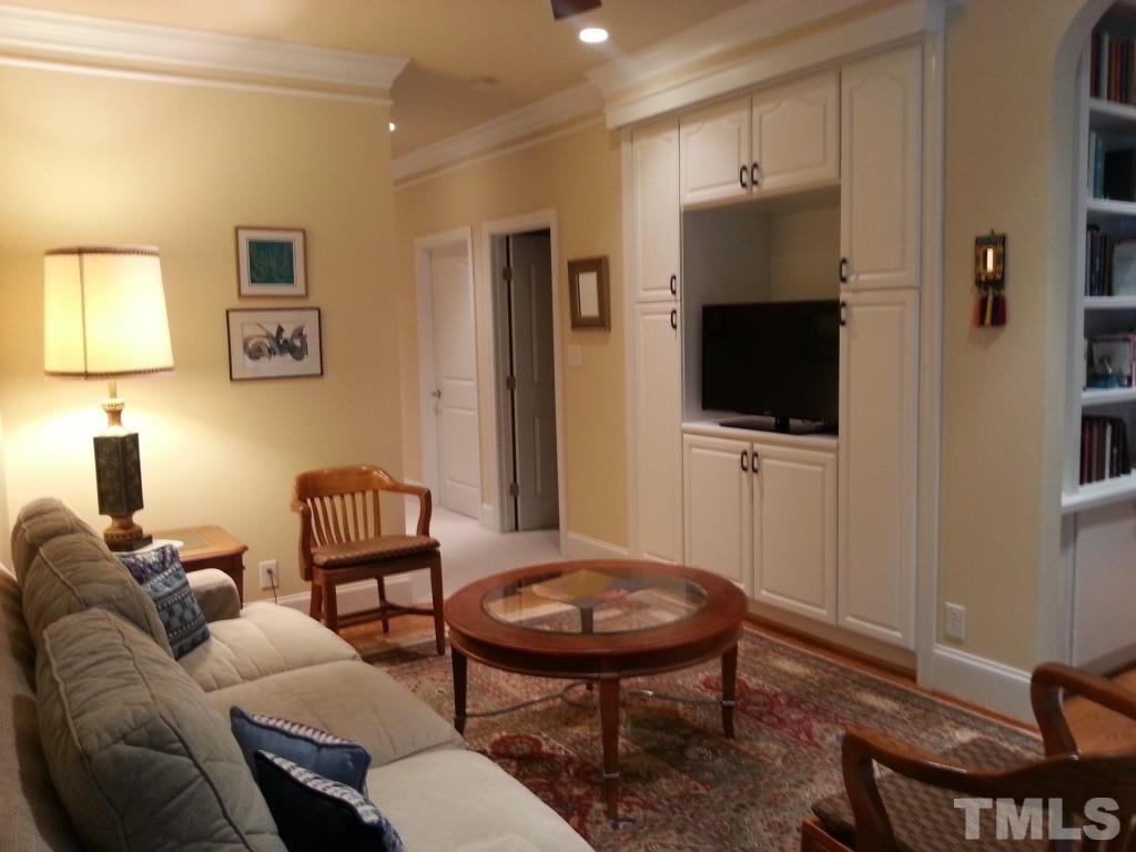 4008 Ovid Lane Raleigh, NC 27613 - Photo 25 of 25 a living room with furniture and a flat screen tv