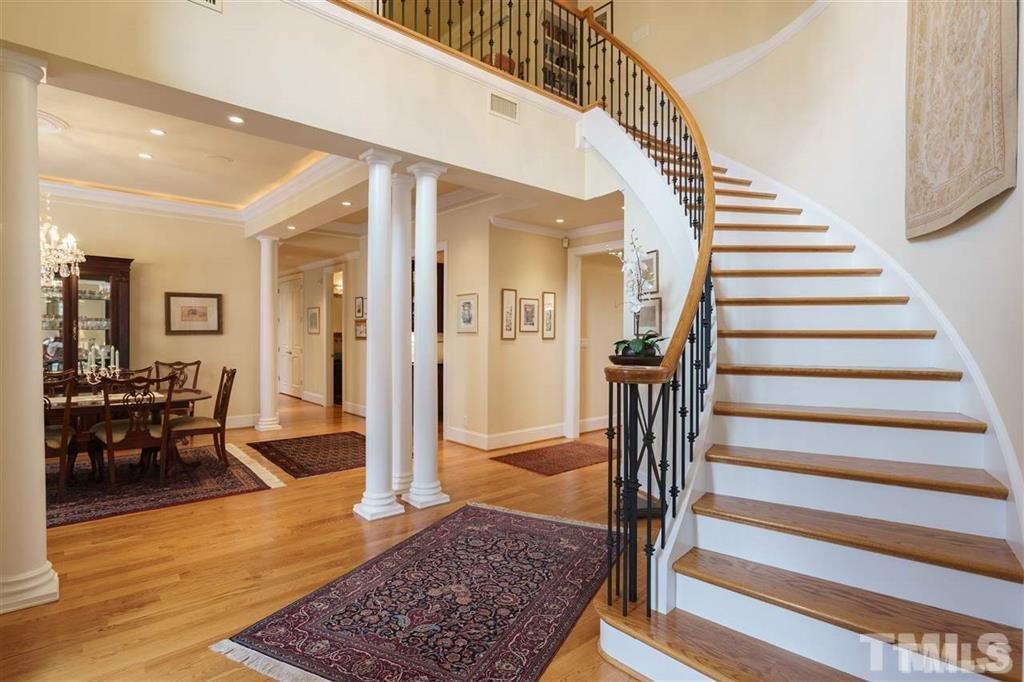 4008 Ovid Lane Raleigh, NC 27613 - Photo 4 of 25 a view of entryway and hall with wooden floor