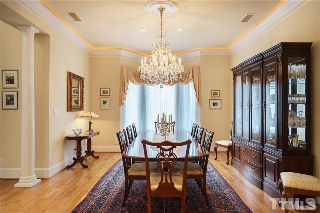 4008 Ovid Lane Raleigh, NC 27613 - Photo 5 of 25 a view of a dining room with furniture and chandelier