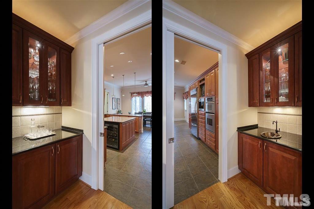 4008 Ovid Lane Raleigh, NC 27613 - Photo 6 of 25 a view of a kitchen from the hallway