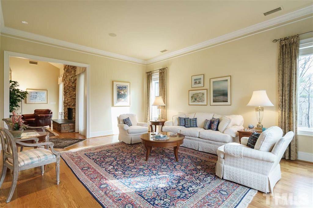 4008 Ovid Lane Raleigh, NC 27613 - Photo 7 of 25 a living room with furniture and a rug
