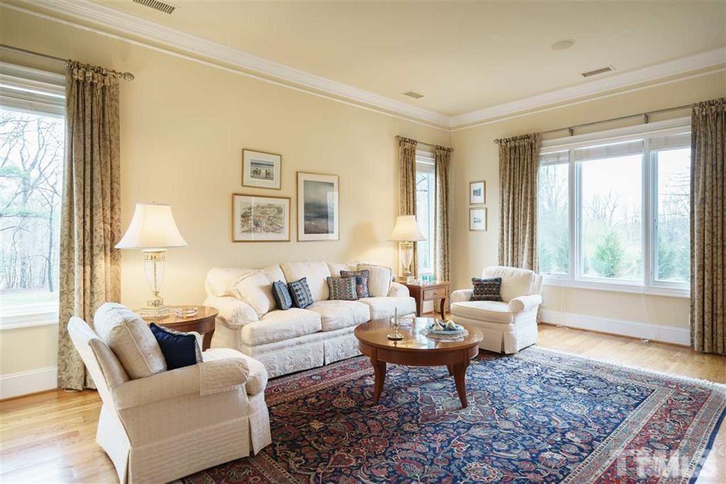 4008 Ovid Lane Raleigh, NC 27613 - Photo 8 of 25 a living room with furniture and a rug
