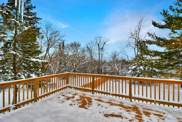 a view of a balcony with wooden fence