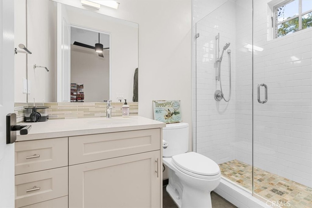 455 Mission Springs Road Arroyo Grande, CA 93420 - Photo 24 of 65 a bathroom with a sink a toilet and shower