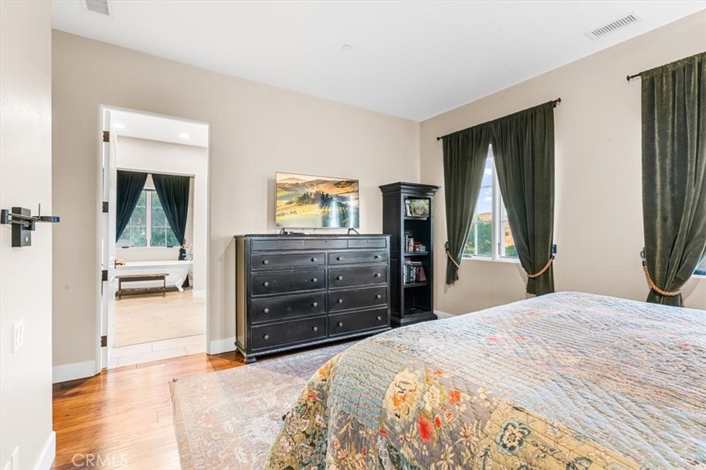 455 Mission Springs Road Arroyo Grande, CA 93420 - Photo 31 of 65 a bedroom with a bed and a dresser