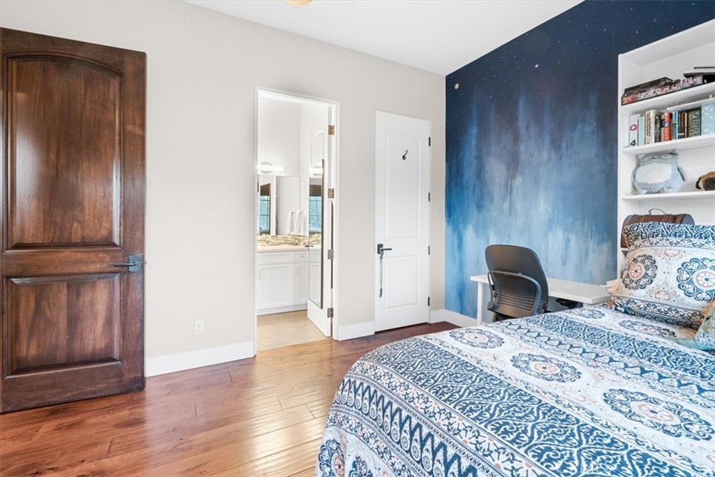 455 Mission Springs Road Arroyo Grande, CA 93420 - Photo 40 of 65 a bedroom with a bed and wooden floor