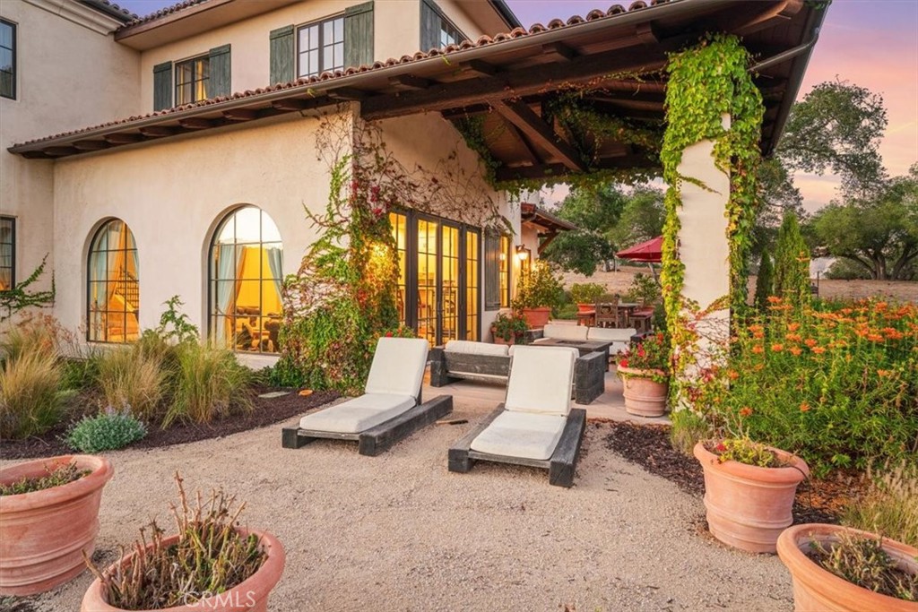 455 Mission Springs Road Arroyo Grande, CA 93420 - Photo 45 of 65 a view of a patio with couple of chairs and a fountain