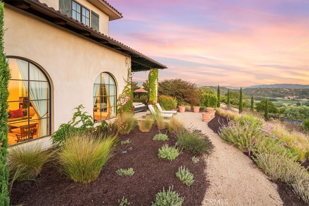 455 Mission Springs Road Arroyo Grande, CA 93420 - Photo 53 of 65 a view of a lake with a floor to ceiling window next to a building