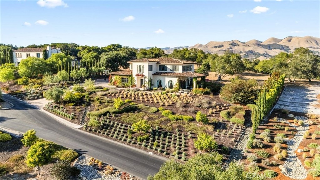 455 Mission Springs Road Arroyo Grande, CA 93420 - Photo 60 of 65 a view of a lake with a mountain in the background