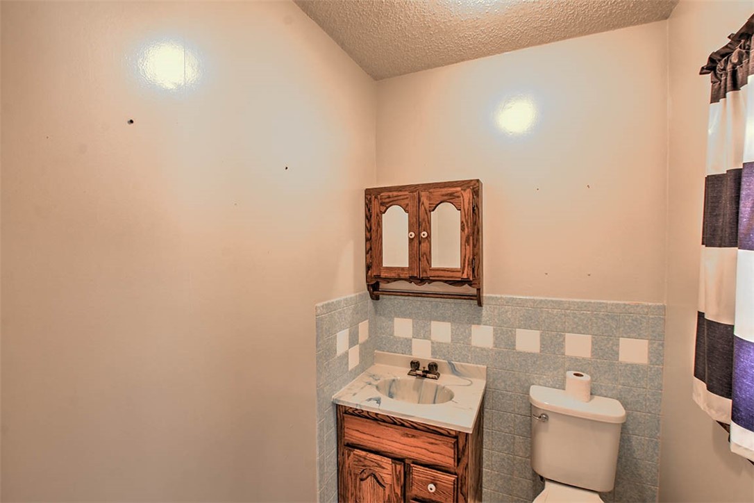 3315 Mount Zion Road Decatur, IL 62521 - Photo 17 of 28 a bathroom with a toilet sink and mirror