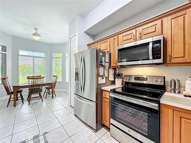 a bathroom with a tub a sink and glass door