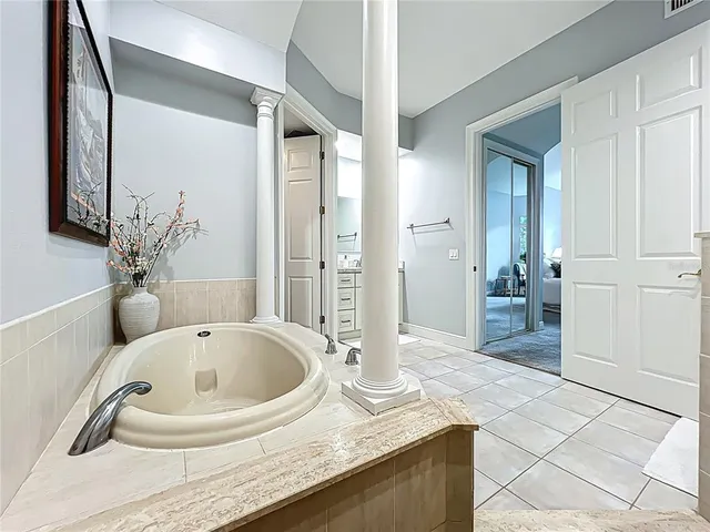 a living room with furniture bathtub and a chandelier
