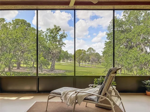a view of a house with backyard porch and sitting area