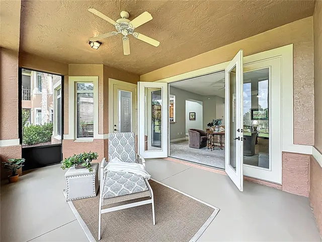 a swimming pool with outdoor seating and yard