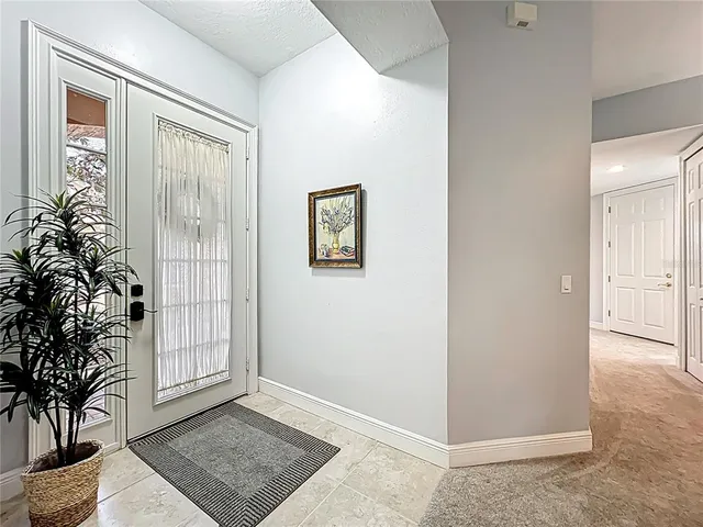 a living room with furniture gym equipment and a flat screen tv
