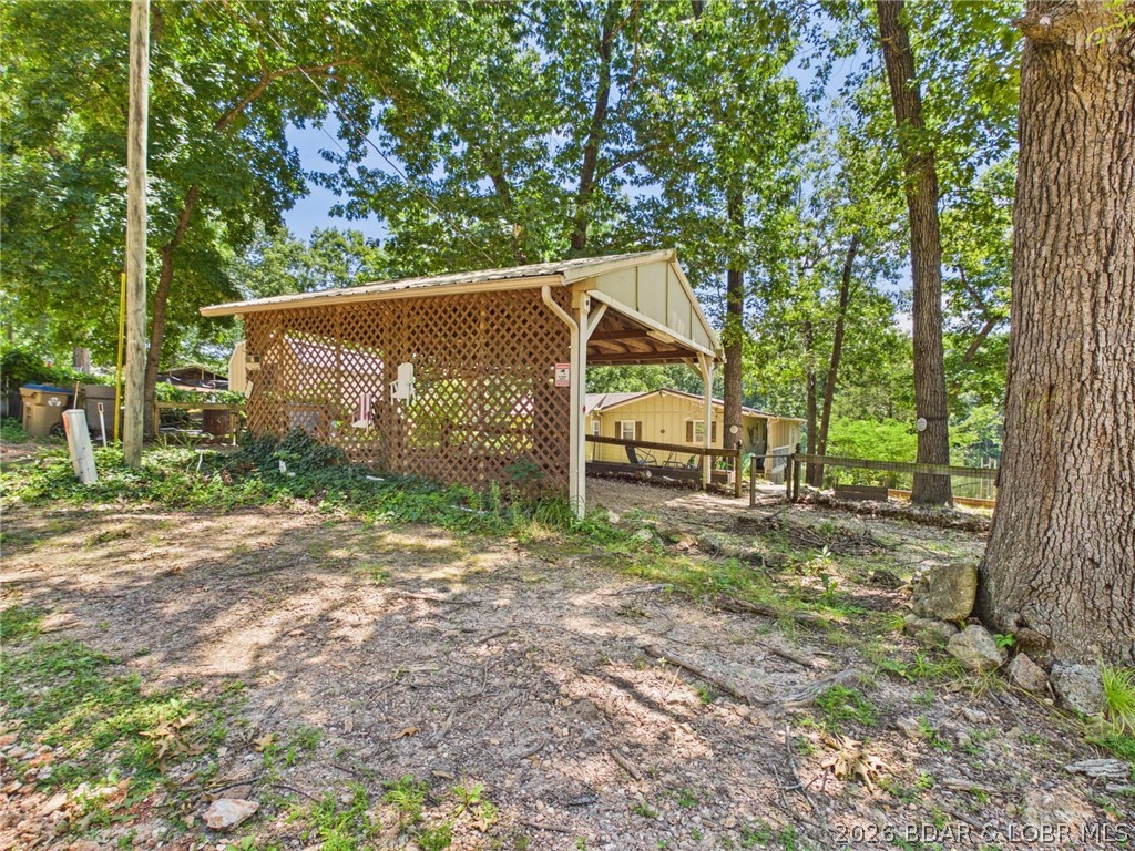 3584 Walnut Hills Road Stover, MO 65078 - Photo 2 of 46 18x19 carport keeps your vehicles out of the weath